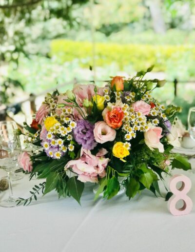 Floral centerpiece arrangement at christening event at Argithea Winery