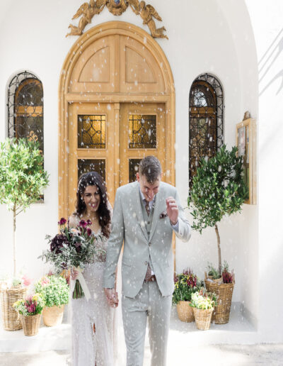 Chick boho wedding floral decoration at Agia Filothei church in burgundy tones