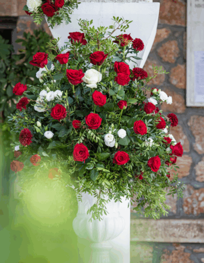 Wedding ceremony floral arrangements with roses at Agia Marina
