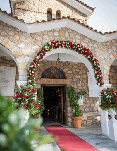 Wedding ceremony floral decoration with white and red roses at Agia Marina